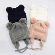 Knitted baby hat with ears and tassels