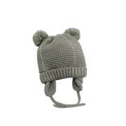 Stickad babymössa med öron och tofsar 