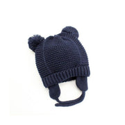 Stickad babymössa med öron och tofsar 